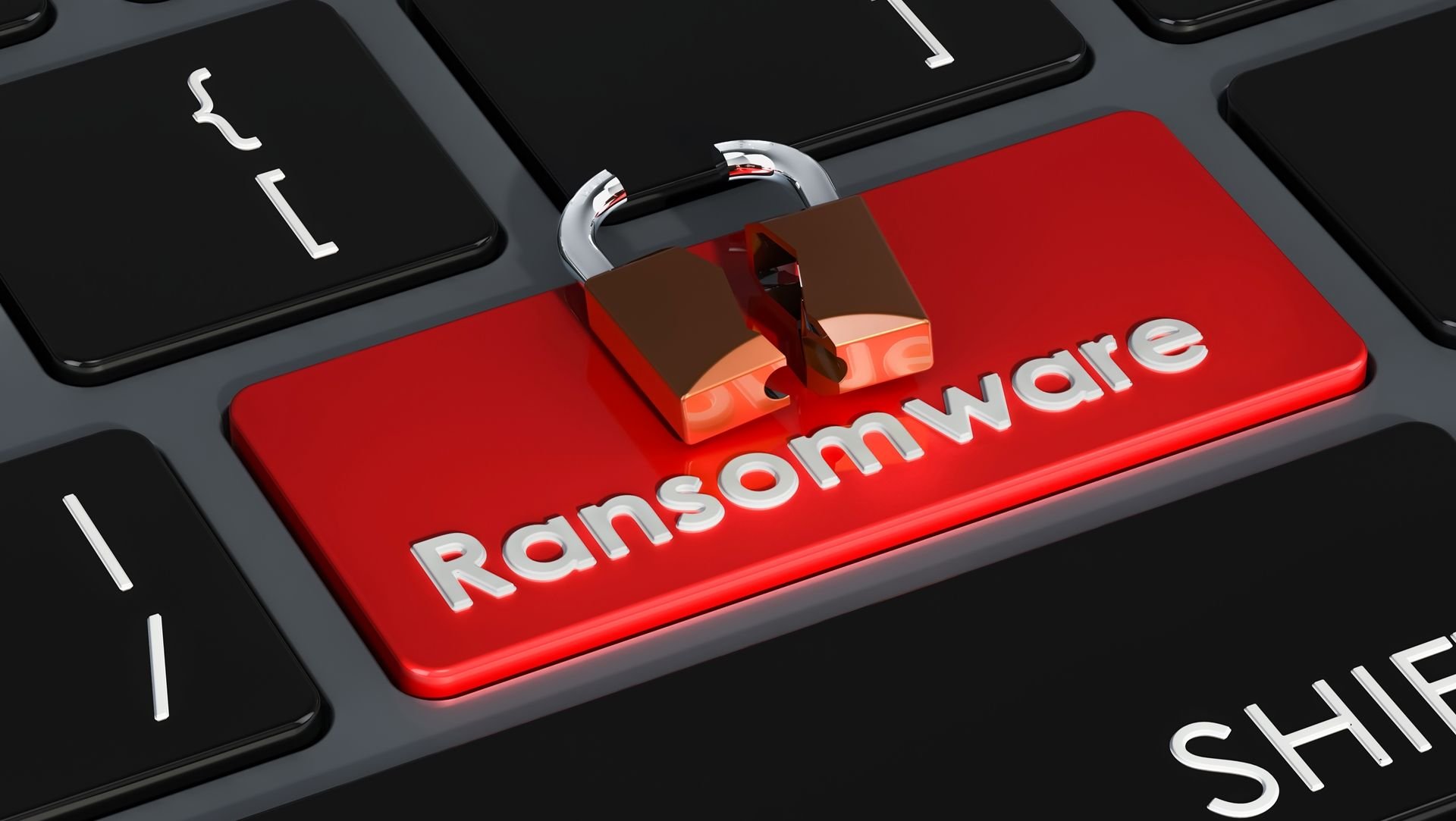 um teclado de computador com uma tecla em vermelho escrita ransomware